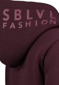 Maroon hoodie with a smooth texture, featuring embossed lettering "SBLVL FASHION" in gradient pink on the upper left shoulder area.