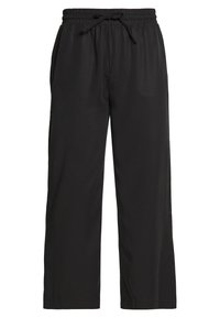 Pantalons noirs ample avec taille élastique et cordon de serrage, dotés de poches latérales et de jambes droites.