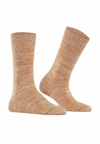 Calze al ginocchio in un morbido filato arancione heather con polsino a coste. Il materiale appare testurizzato con un sottile motivo, offrendo calore.