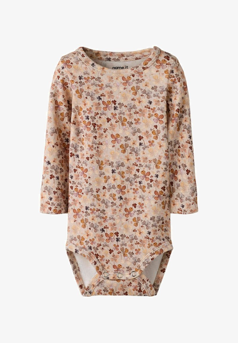 Body z długim rękawem wykonane z miękkiej bawełny, w jasnobeżowej bazie z wielokolorowymi wzorami kwiatowymi, z zapięciami na zatrzaski na dole.