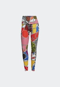 Leggings colorés présentant un mélange de motifs comprenant des cercles, des imprimés animaliers et des formes géométriques en rouge, jaune, rose, bleu et noir.