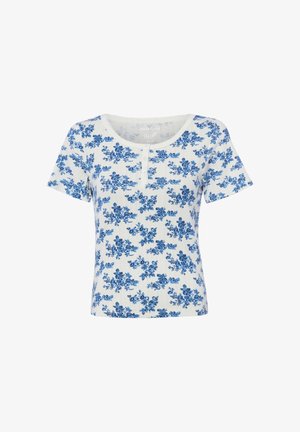White short-sleeve ribbed top with round neckline, small front buttons, and blue floral print all over.