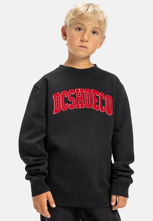 Schwarzer Sweatshirt mit Rundhalsausschnitt und langen Ärmeln. Verfügt über ein rot besticktes "DCSHOECO"-Logo auf der Brust. Weicher, strukturierter Stoff.