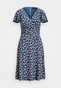 Marinblå omslagsklänning med korta ärmar, prydd med ett vitt blommönster. Slät textur, V-ringning och dragkedjestängning bak.