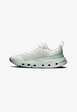 White athletic sneaker with mesh upper, cushioned sole featuring ventilation holes, and light green accent on the heel area.