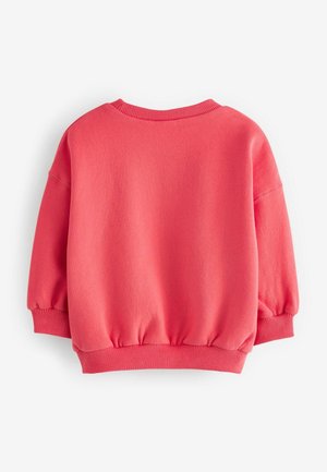 Sudadera de color coral con cuello redondo, mangas abullonadas y puños acanalados. Textura suave con un dobladillo fruncido en la cintura.