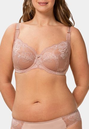 Podprsenka s krajkovým lemováním v broskvové barvě, zdobená květinovými vzory, s nastavitelnými ramínky a malým drahokamem uprostřed. Jemný, průsvitný materiál.