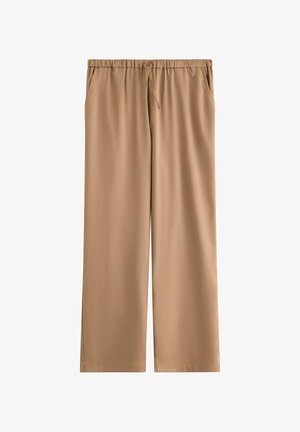 Beige viddebukser med elastik i taljen og snøre, med sidelommer, vist fladt på hvid baggrund.