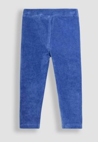 Kék kordbársony leggings, puha textúrával, rugalmas derékpánttal és karcsú fit dizájnnal, további minták vagy díszítések nélkül.