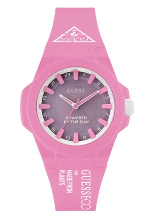 Montre solaire rose avec un bracelet en silicone texturé. Présente un cadran dégradé violet, des marquages blancs et des accents audacieux.