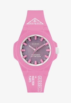 Rozā saules enerģijas pulkstenis ar teksturētu silikona siksniņu. Iezīmējas ar gradienta purpura ciparnīcu, baltām norādēm un izteiksmīgiem akcentiem.