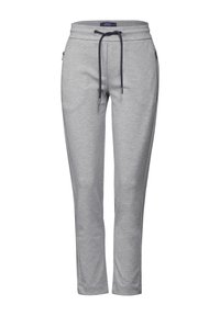 Grå sweatpants med dragsko i midjan, sidofickor, avsmalnande ben och ett mjukt, texturerat tyg. Har marinblå detaljer på dragskon.
