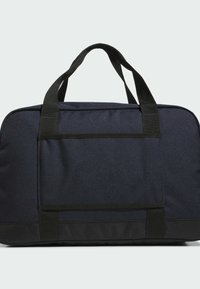 Black duffel bag made of durable fabric. Features dual black handles and a horizontal pocket on the front. Smooth texture, structured shape.