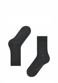 Calze in cotone grigio scuro con una trama liscia, caratterizzate da un bordo a coste e dettagli del logo stampati sulla suola. Design classico, altezza alla caviglia.