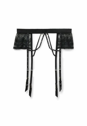 Ce porte-jarretelles en dentelle noire présente des bretelles réglables, des éléments en métal doré, des accents translucides, un ourlet festonné et un nœud au centre.