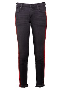 Svarta skinny jeans med röda sidostråk, fransade fållar och klassisk femfickedesign. Tillverkade av denimtyg med en slät yta.