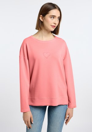 Lichtroze sweatshirt met een relaxte pasvorm, voorzien van een geborduurd hartlogo in het midden en een geribbelde halslijn. Lange mouwen met manchetten.