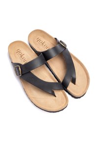 Black leather sandals with a textured tan footbed and a brown outsole. Features a cross-strap design with a gold-tone buckle accent.