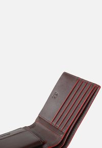 Brown leather wallet with red accents, featuring multiple card slots, a smooth texture, and an embossed logo on the interior.