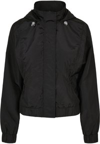 Zwarte windbreaker met een hoge kraag, drukknoopsluiting, elastische manchetten en een cropped design. Gladde, lichte stof zonder zichtbare patronen.