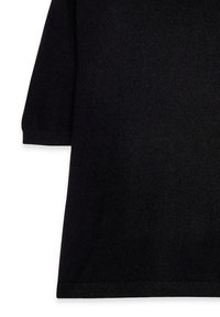 Top noir en tricot à manches courtes, avec une texture lisse et un ourlet côtelé. Design simple sans motifs ni accents.