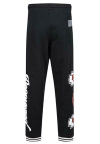 Svarta sweatshirtbyxor med vit grafisk text och röda accenter. Har en slim fit, elastisk midjeband och randiga manschetter vid anklarna.