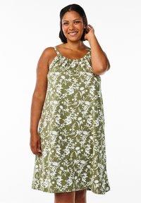 Zeleno obleka brez rokavov z belo cvetličnim vzorcem, nabranim izrezom in silhueto A-linije, izdelana iz lahkega blaga.
