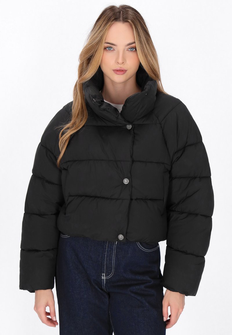 Black cropped puffer jacket with a high collar, featuring horizontal quilted sections and silver buttons. Soft, shiny material with a smooth texture.