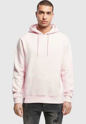 Light pink hoodie made of soft fabric, featuring a kangaroo pocket and drawstring hood. Standard fit with ribbed cuffs and hem.