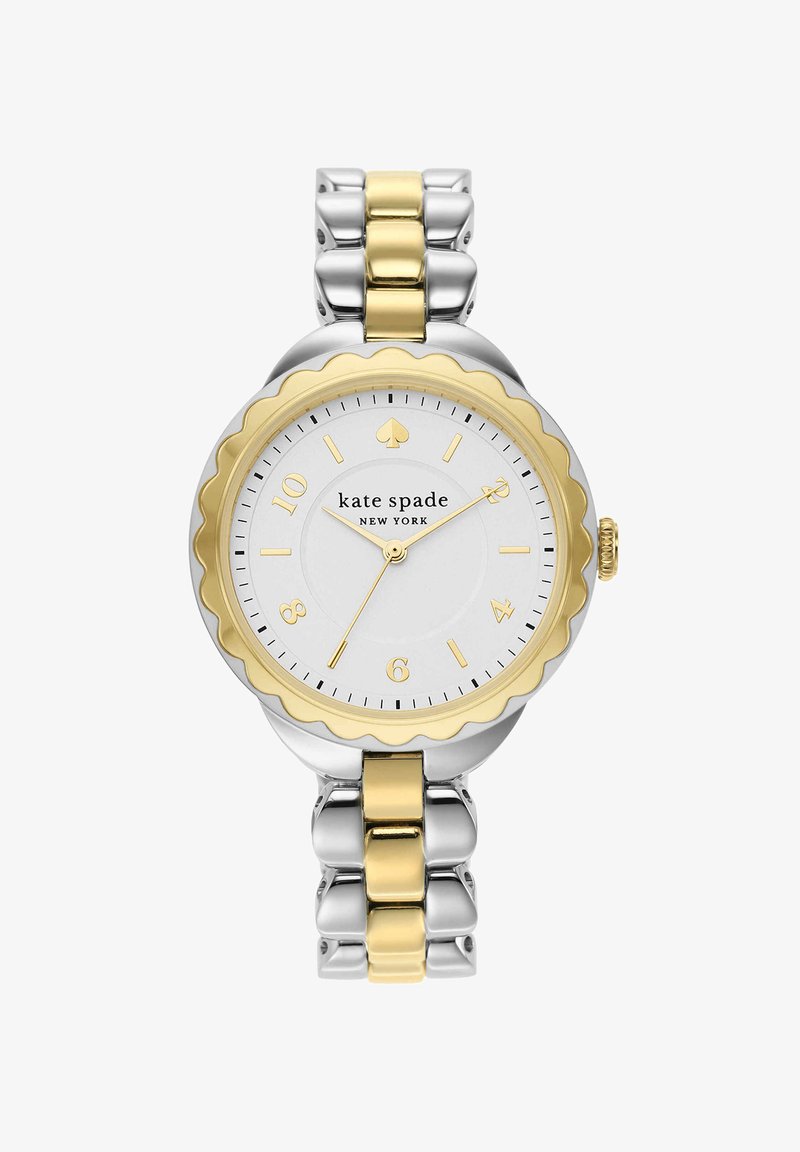 Reloj de pulsera bicolor plateado y dorado Kate Spade New York con bisel dorado festoneado y esfera blanca que muestra la hora 10:34:11.