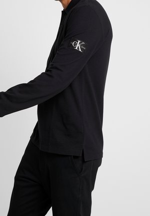 Pikeepaita - black