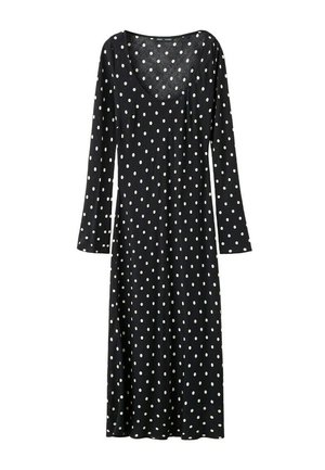 Vestido midi negro de manga larga con lunares blancos y escote redondo, ligeramente ajustado en la cintura.