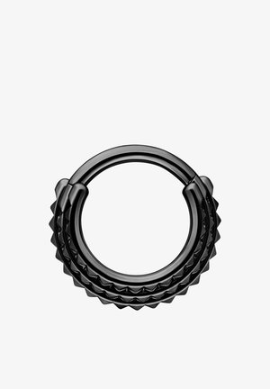 Black circular ring with a textured, zigzag pattern around its outer edge on a white background.