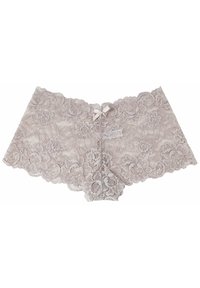 Perizoma in pizzo beige chiaro con motivo floreale. Presenta bordi ondulati e un piccolo fiocco al centro. Texture morbida e trasparente.