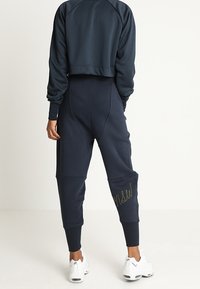 Nike Sportswear Teplákové kalhoty - dark blue