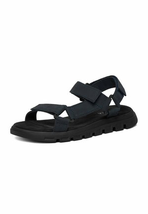 Schwarze Outdoor-Sandale mit dicker Gummisohle und verstellbaren Klettverschlüssen über Zehen, Knöchel und Ferse für sicheren Halt.
