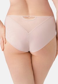 Lichtroze hoogzitpanty's van een gladde, textuurstof met een ronde accent aan de achterkant en naadloze randen voor comfort.