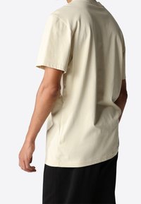 The North Face Camiseta estampada - beige