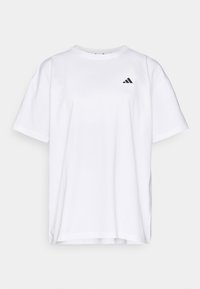 T-shirt en coton blanc avec un col rond, des manches courtes et un logo Adidas noir sur le côté gauche de la poitrine. Design simple et coupe décontractée.