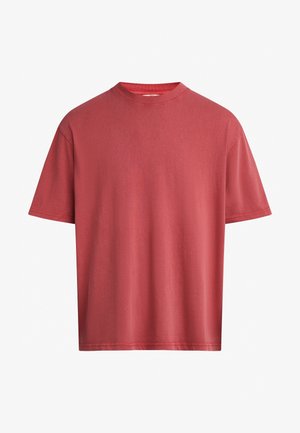 Red cotton t-shirt with a classic crew neckline, short sleeves, and a relaxed fit. Soft texture with no visible patterns or embellishments.