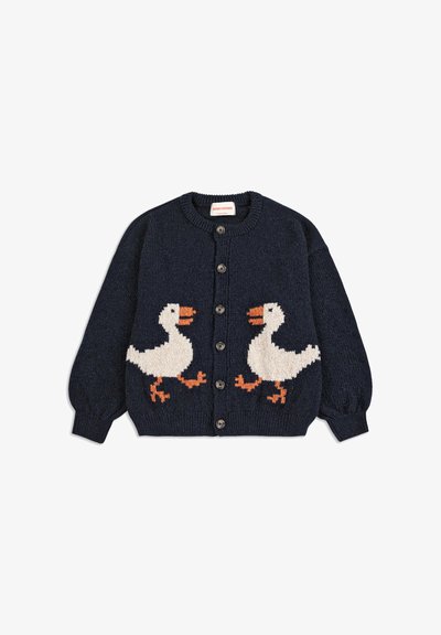 Námořnický pletený kardigan s motivem dvou bílých hus s oranžovými akcenty, kulatým výstřihem, předními knoflíky a žebrovanými manžetami.