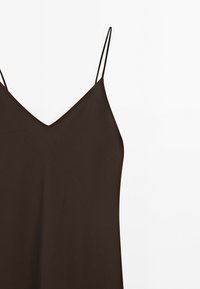 Dark brown sleeveless dress with thin spaghetti straps and a V-neckline on a white background.