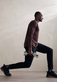 adidas Sportswear ESSENTIALS - Teplákové kalhoty - black