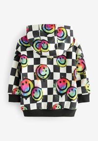 Hoodie z czarno-białym wzorem w kratkę, ozdobiony kolorowymi uśmiechniętymi buźkami i teksturowanym wykończeniem.