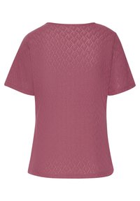 Texturiertes, kurzärmliges Oberteil in staubrosafarbener Farbe mit geometrischem Muster und lockerem Schnitt. Glattes Material mit leichtem Stretch.