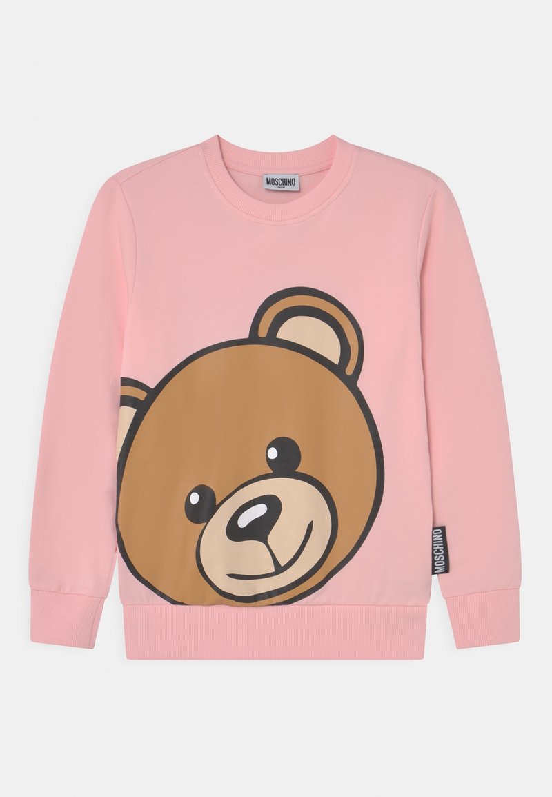 Rosa långärmad sweatshirt med en stor leende brun nallebjörnsansikte på framsidan, samt ribbade muddar och nederkant.