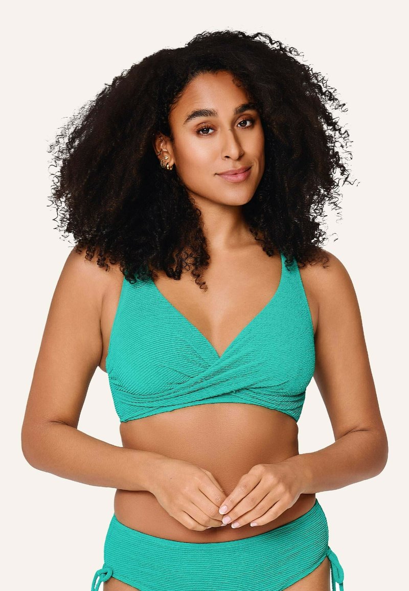 Teal textuur bikini-top met een wikkelontwerp en brede schouderbanden. Bevat een bijpassende onderkant met verstelbare stropen aan de zijkanten.