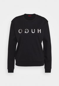 Czarna bluza z bawełny z dodatkiem włókien syntetycznych. Posiada okrągły dekolt, długie rękawy oraz metalicznie srebrne logo "HUGO" z przodu.