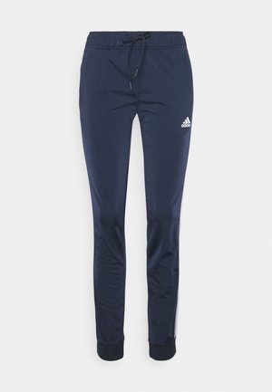 Donkerblauwe Adidas trainingsbroek met elastische tailleband, trekkoord, taps toelopende pijpen, geribbelde enkels en wit logo op linker bovenbeen.