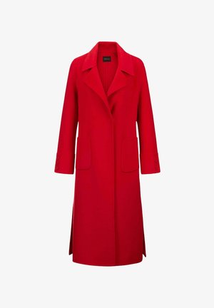 Red wool coat with a lapel collar, long sleeves, and two front pockets. Notable button accents on cuffs and side slits for ease of movement.